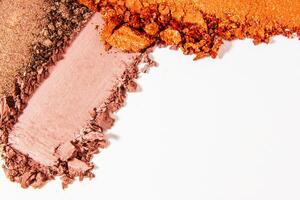 Composition of eyeshadow smears on a light white background. Cosmetic texture, vibrant and layered. photo