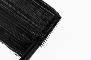 Smudged mascara texture on a light background. photo