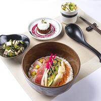 Seafood Chirashi Don including prawn, shrimp, fish meat, Tofu seaweed salad served in broth and Chocolate lava cake ice cream isolated on napkin side view of Japanese food on white background photo