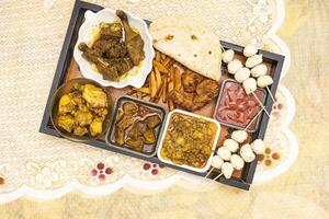 Beef Curry, Beef Bot, Fried Chicken, Chicken Balls Skewers, Desi Chicken karahi, Duck Curry, French Fries, Roti and Tomato Sauce photo