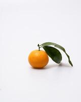 oranges and tangerines with leaves whole and in size lie on a white background photo
