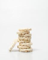wheat rice breads, biscuits on a white background crumbled and whole photo