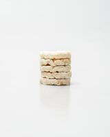 wheat rice breads, biscuits on a white background crumbled and whole photo