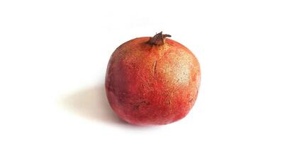 Fresh Pomegranate fruit or buah delima isolated on white background photo