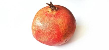 Fresh Pomegranate fruit or buah delima isolated on white background photo