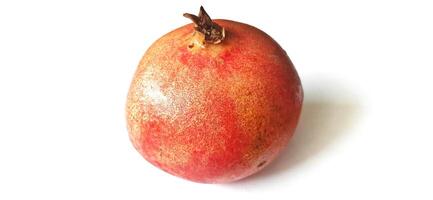 Fresh Pomegranate fruit or buah delima isolated on white background photo