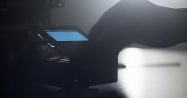 Anonymous engineer using display of 3D printer video