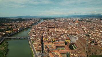 Drone aerial view shot of Florence skyline, Cathedral of Saint Mary of the Flower, Ponte Vecchio and The Arno River, Tuscany region, Italy video