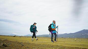 Amazing Landscape With Mountains Range, Two Female Hikers Walking Together On Mount Slope video