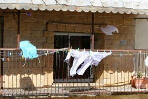 washed clothes hanging on a line photo