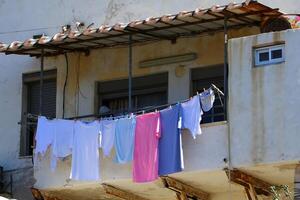 washed clothes hanging on a line photo