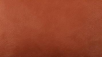 Rich and detailed leather texture in warm tones, featuring natural grain patterns. Perfect for luxury branding, product visuals, and creative decorative backgrounds. photo