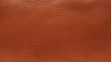 A dark reddish-brown leather texture with a bold and rugged grain pattern, suitable for rustic designs, branding, and high-quality decorative graphics. photo