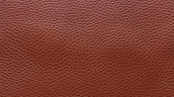 A deep brown leather texture with bold grain patterns, offering a timeless and elegant look for luxury branding, product visuals, and premium decorative designs. photo