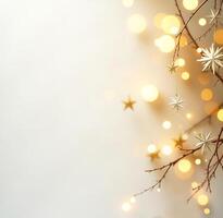 Christmas background with a tree branch, golden stars and bokeh on a light background photo