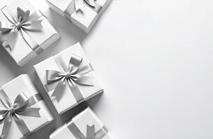 White boxes with silver bows on white background photo