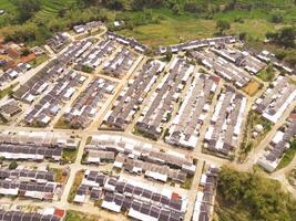 High angle view of Real Estate from 200 meters high. A real estate built on the outskirts of Bandung City, Indonesia. Housing and Settlement. Drone Photography Themes photo