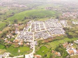 High angle view of Real Estate from 200 meters high. A real estate built on the outskirts of Bandung City, Indonesia. Housing and Settlement. Drone Photography Themes photo
