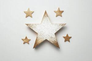 Glittering gold and white stars arranged artistically on a neutral background photo