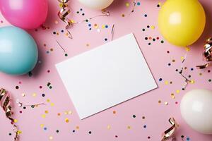 Colorful celebration setup with balloons and confetti on a pink background for party invitations photo