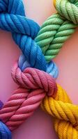 Colorful twisted rope featuring a vibrant rainbow gradient on a light background photo