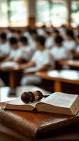 Group study session in a bright classroom with a focus on law books and gavel photo