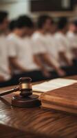 Group study session in a bright classroom with a focus on law books and gavel photo