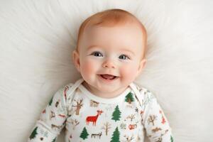 Smiling baby with red hair seated on soft blanket in cozy indoor setting during daytime photo