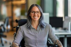 Young woman in wheelchair smiles while sitting in modern workspace with natural light photo