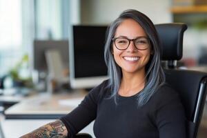 Young woman in wheelchair smiles while sitting in modern workspace with natural light photo