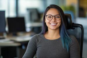 Young woman in wheelchair smiles while sitting in modern workspace with natural light photo