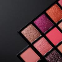 Colorful makeup palette with various shades arranged in a grid pattern for beauty enthusiasts photo