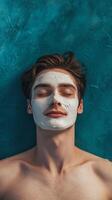 Man enjoying facial mask treatment in a vibrant indoor setting for skincare relaxation photo