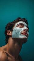 Man enjoying facial mask treatment in a vibrant indoor setting for skincare relaxation photo