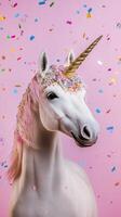 Enchanted unicorn with rainbow confetti against a pink background during a playful celebration photo