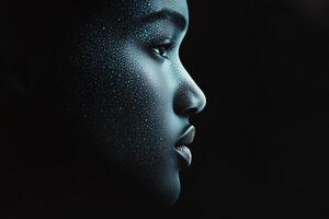 Intricate profile of a person with shimmering droplets reflecting light in dark setting photo