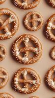 Freshly baked pretzels with colorful sprinkles arranged neatly in a pattern photo