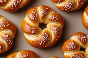 Freshly baked sweet rolls arranged in a neat pattern on a light background photo
