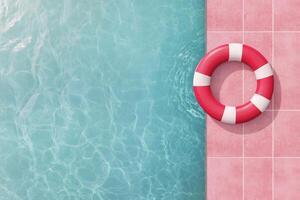 Lifebuoy on the edge of a tranquil swimming pool surrounded by pastel tiles photo