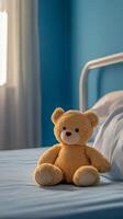 Soft bear sitting on a bed in a cozy blue room with calming atmosphere photo