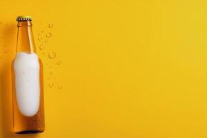 Golden beer bottle with foam on top against a bright yellow background photo