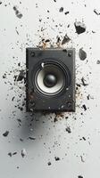 Explosive sound wave with shattered speaker parts in dynamic display of energy and motion photo