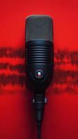 Classic microphone on a vibrant red background with sound wave pattern behind it photo