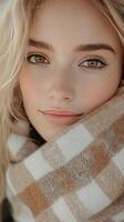 Close up of a young woman wrapped in a scarf enjoying a cozy winter day outdoors photo