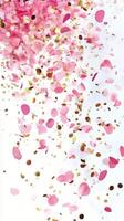 Colorful confetti made of pink petals and gold flakes falling gracefully from above photo