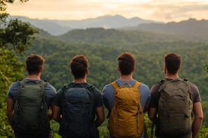Group of hikers observing a majestic mountain landscape in the wilderness photo