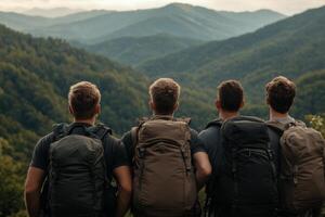 Group of hikers observing a majestic mountain landscape in the wilderness photo