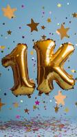 Celebration with golden balloons marking achievement of 1K on a festive backdrop photo