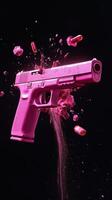 Pink explosion from a gun creating vibrant splashes in a dark setting photo