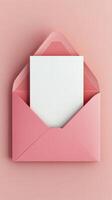 Soft pink envelope with blank card surrounded by decorative pink petals on a pastel surface photo